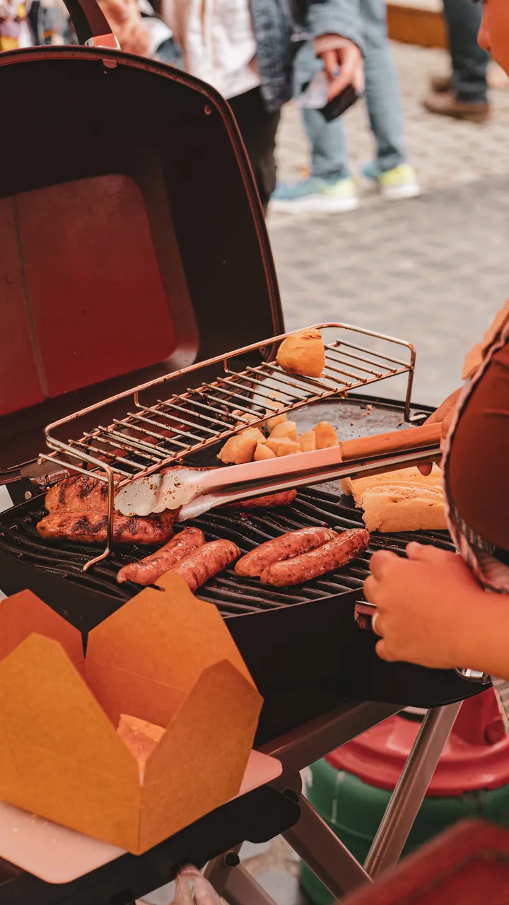 Argentinian sausages grilling on the parrilla
